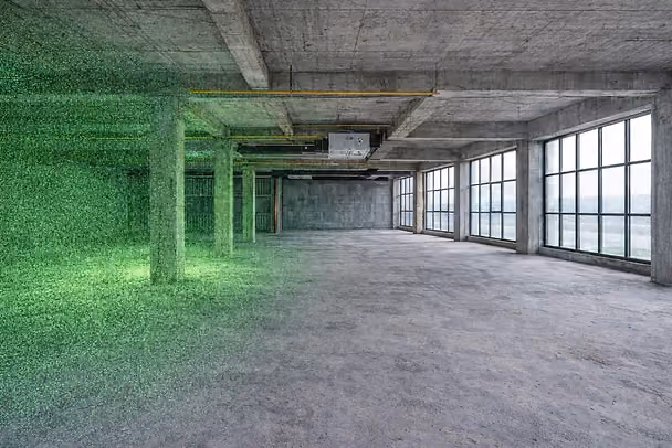 Empty industrial space with concrete columns and large windows on the right. Green digital grid covers the left, creating a futuristic feel.