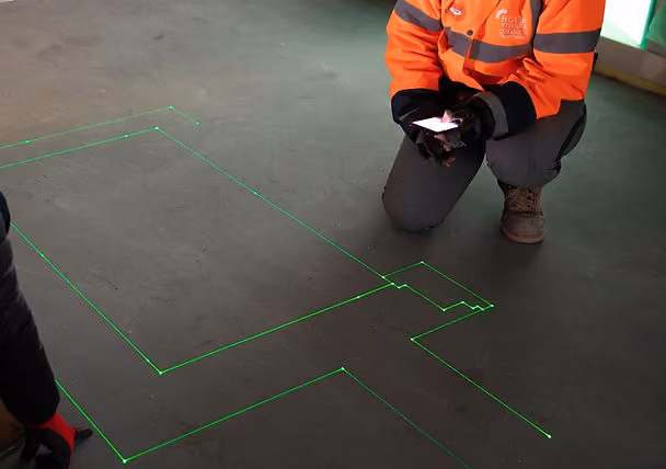 Laser level buying guide showcasing construction floor enabling accurate layout with reduced rework and professional laser precision