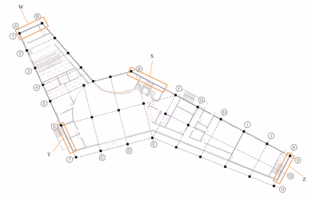 Floor plan with labeled sections A to Z, showing rooms and corridors. Orange rectangles highlight key areas. Grid lines structure layout.