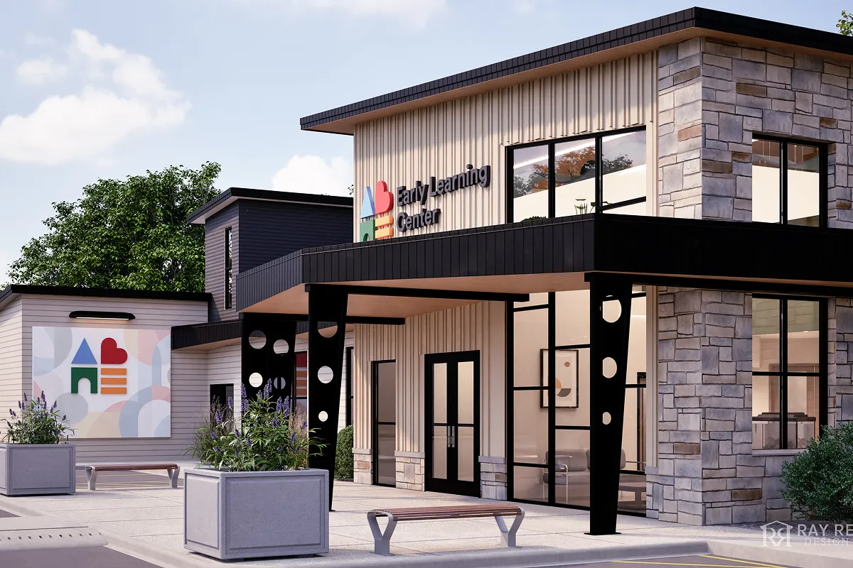 Modern Early Learning Center building with stone and siding exterior, large windows, black canopy, and outdoor benches with planters.
