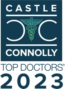 The image features the Castle Connolly Top Doctors 2023 logo. It includes a green caduceus symbol between two "C" letters, with blue background and white text.