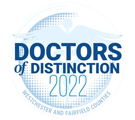 Circle logo with text "Doctors of Distinction 2022." Features a caduceus symbol and reads, "Westchester and Fairfield Counties" in blue tones.