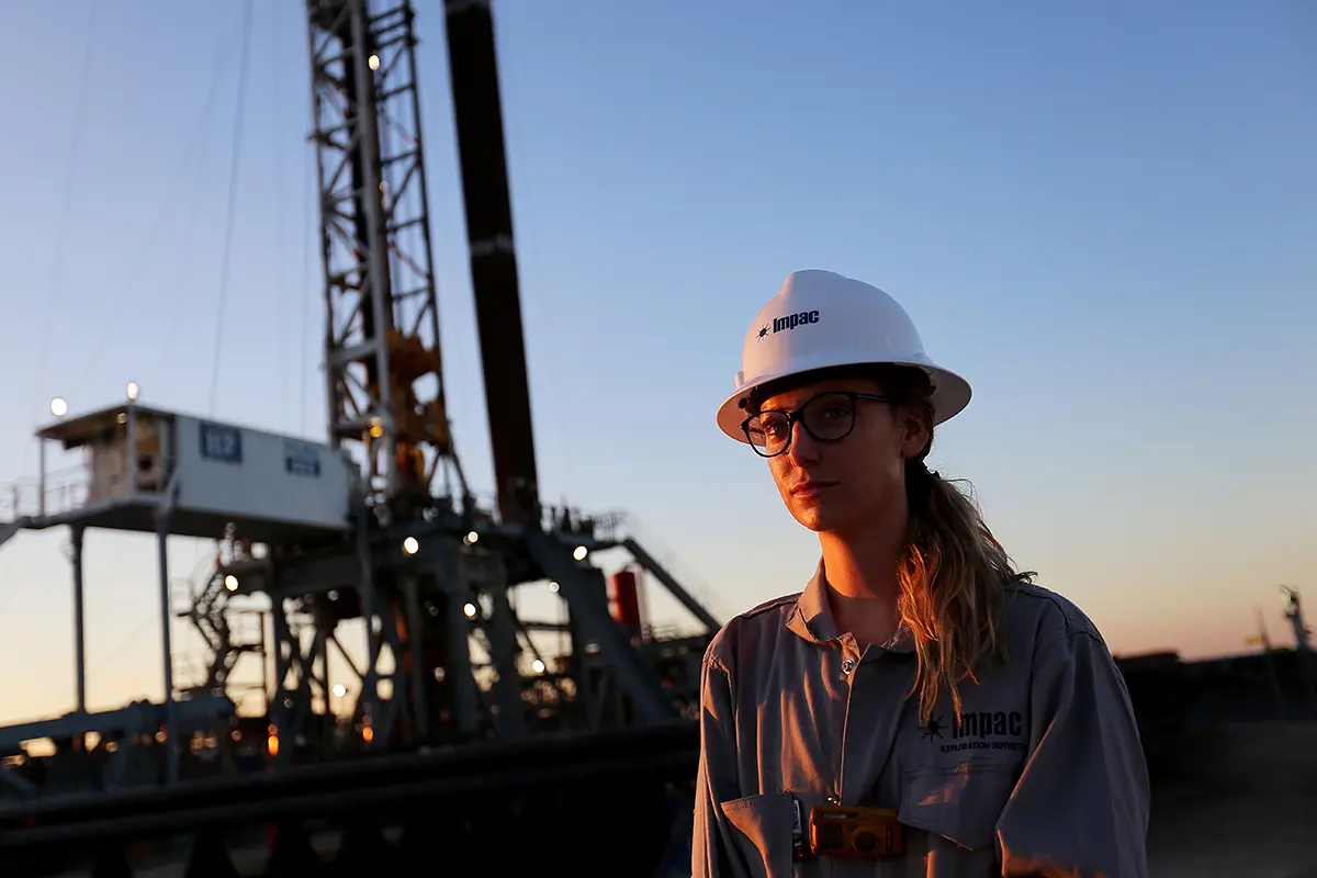 Field worker standing at a rig