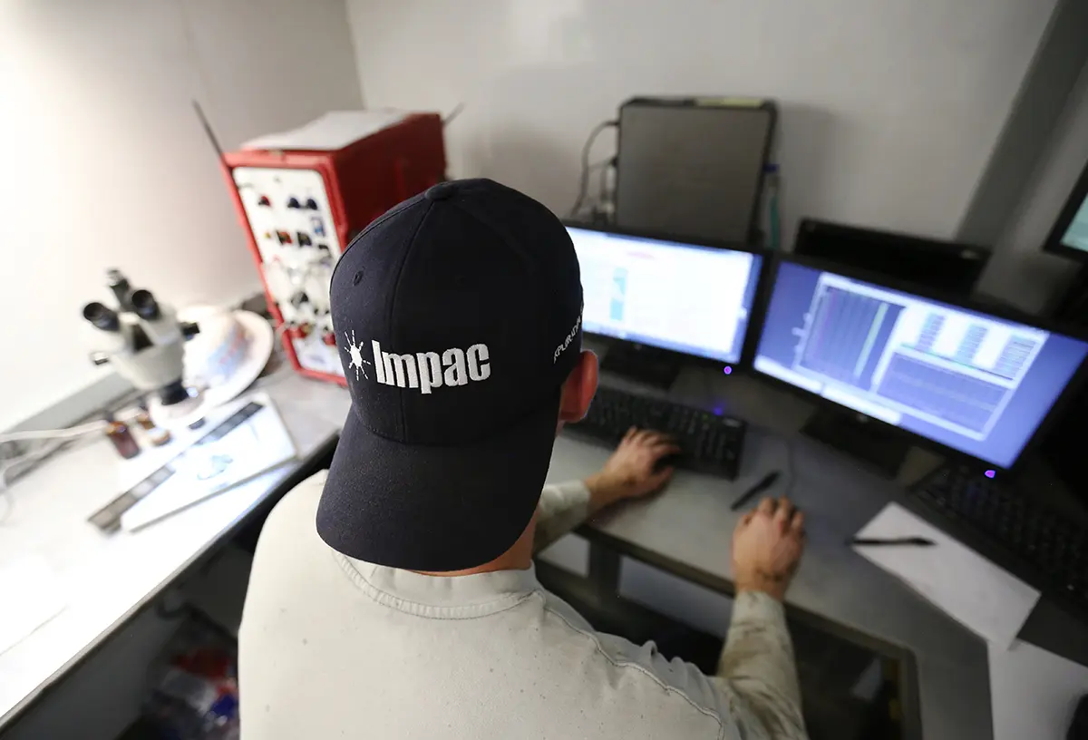 IMPAC team member at a workstation