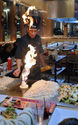 A family enjoying chef tepanyaki celebrations sushi dinner