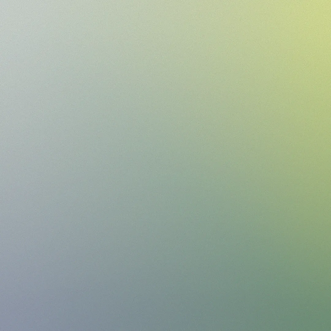 Abstract gradient background transitioning from blue and purple in the bottom left to yellow and green in the top right.