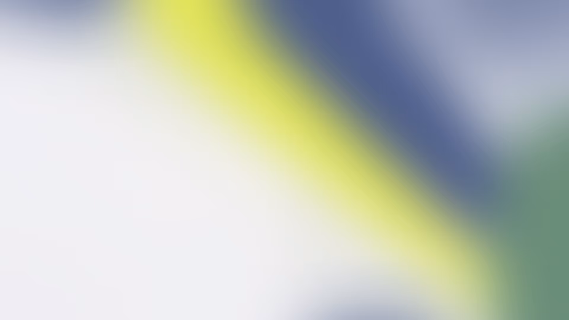 Abstract blurred background with diagonal streaks of yellow, blue, green, and white colors.