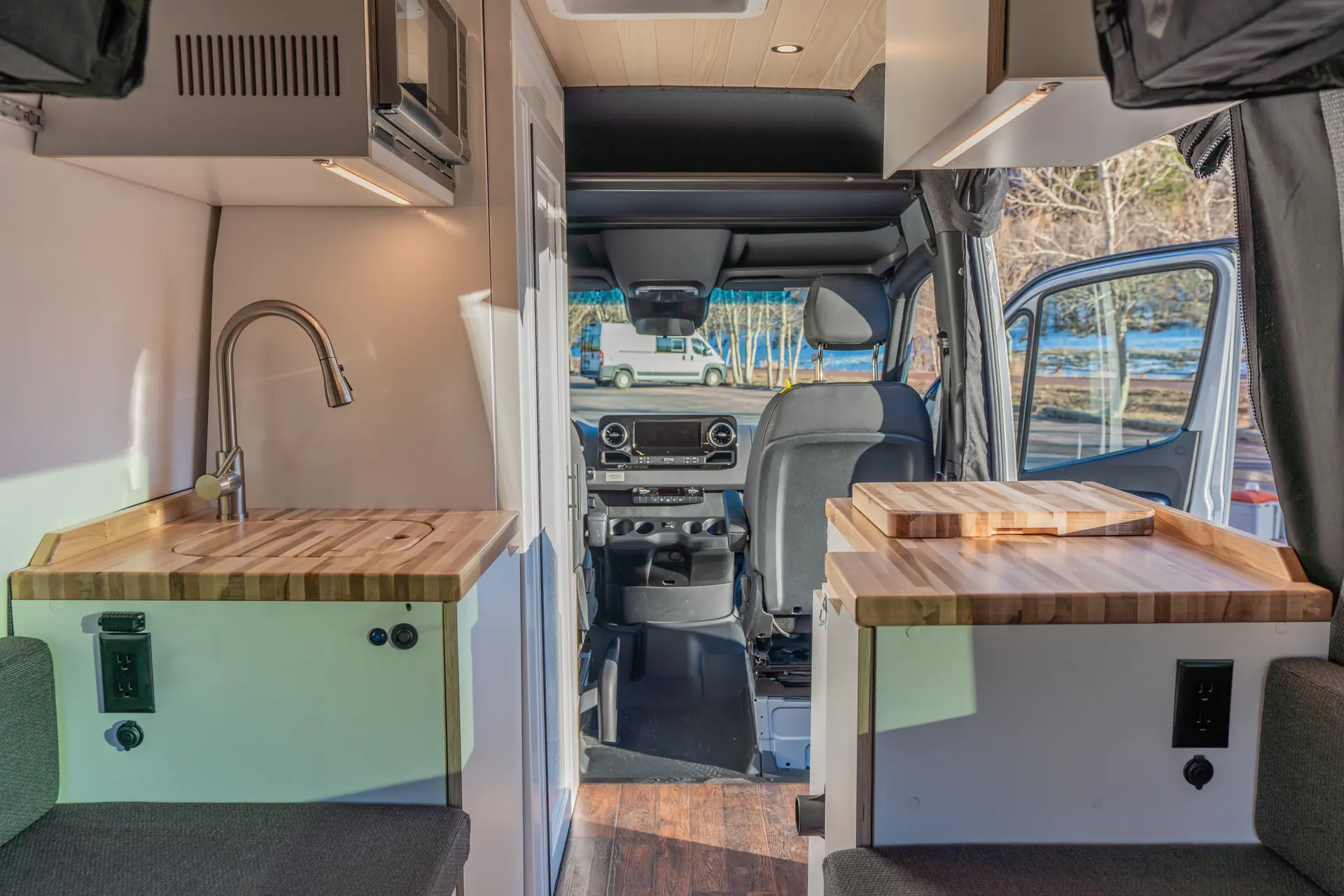 Custom mobile office with dual monitors and walnut desk