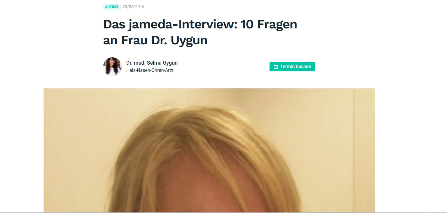 Blonde woman's hair and forehead against beige background, part of an interview with Dr. Uygun.