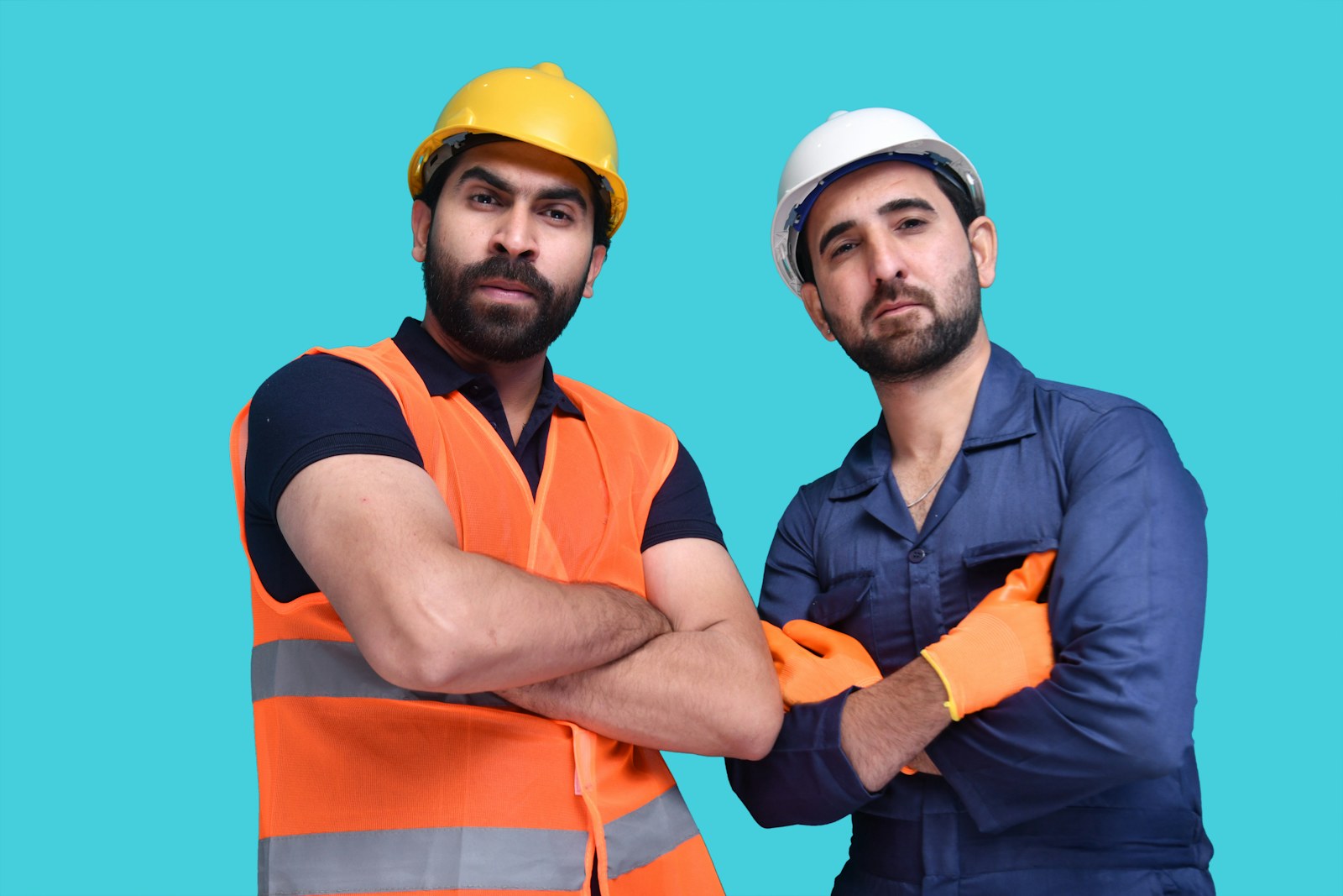 Construction workers wearing hard hats, builders risk insurance