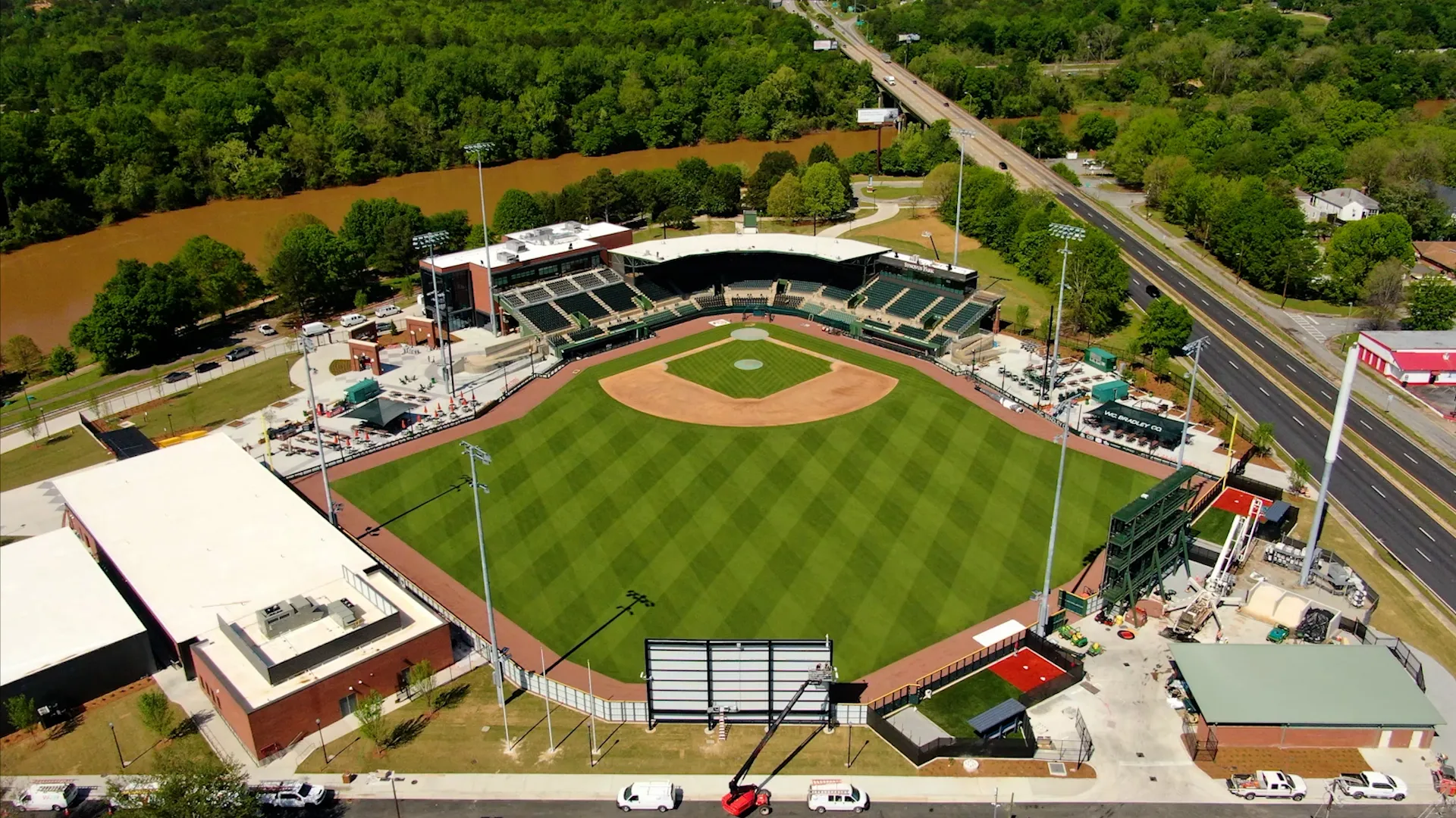 Aerial view of a baseball stadium with green field
