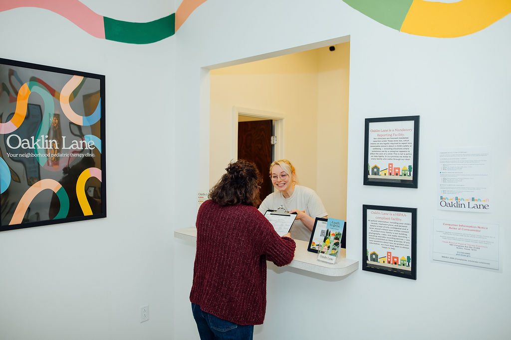 Parent checking in at the Oaklin Lane front desk