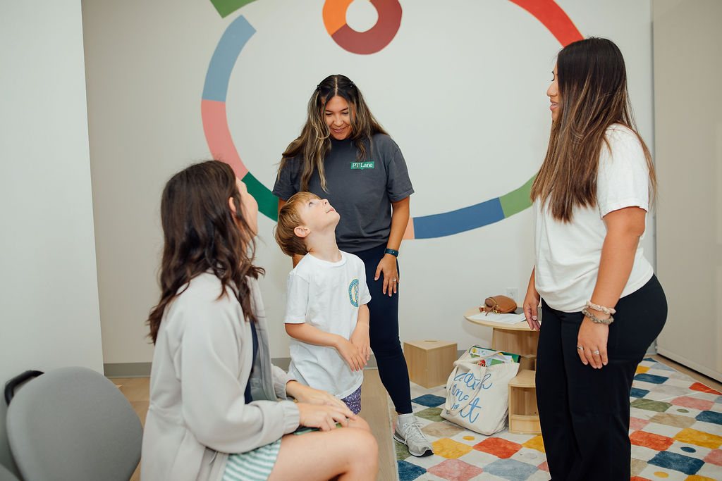 Parent and child meeting Oaklin Lane therapists in the waiting area