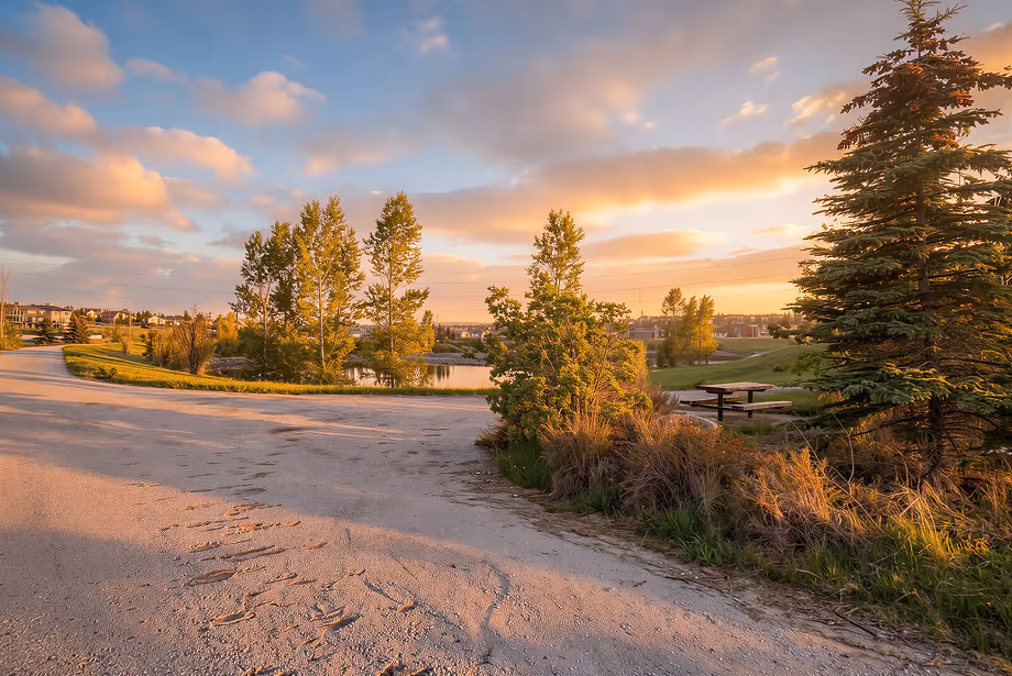 Walking pathway and pond at sunset in Sage Hill, NW Calgary
