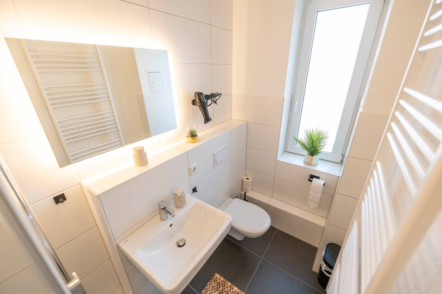 Bathroom with bright mirror