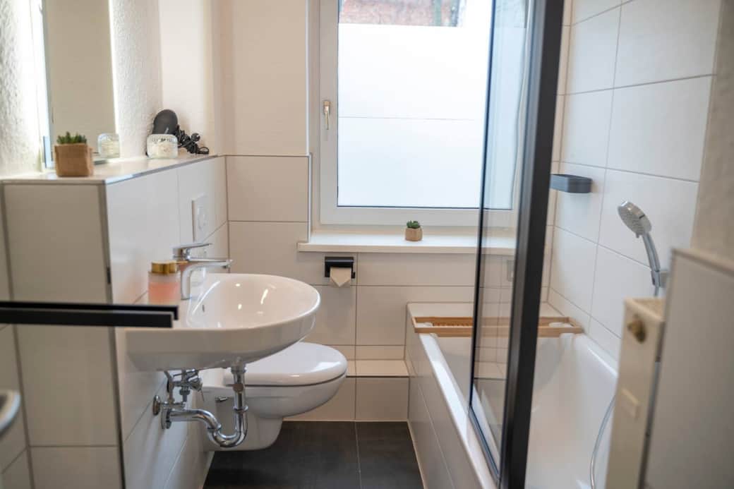 Bathroom with bathtub & shower screen