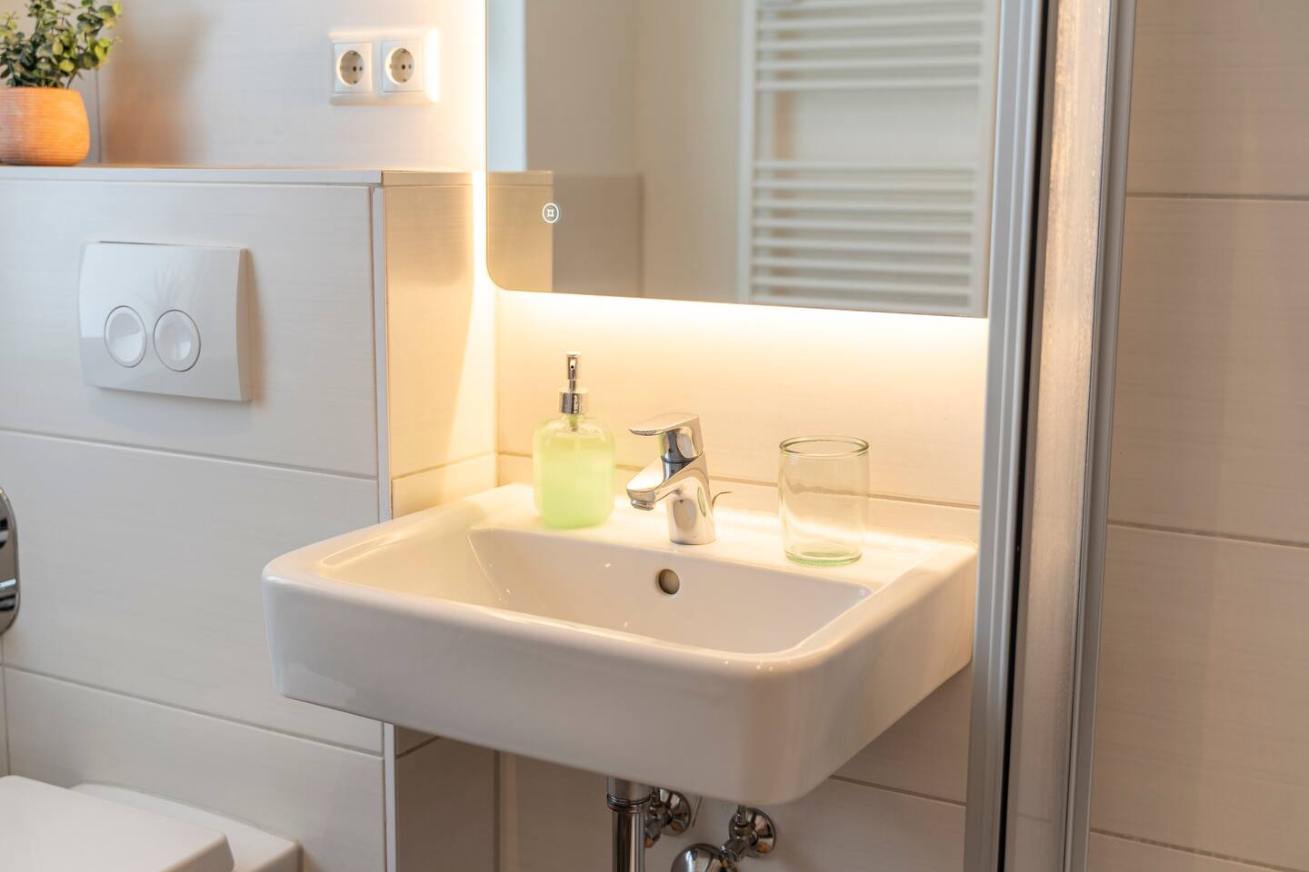 Sink and illuminated mirror