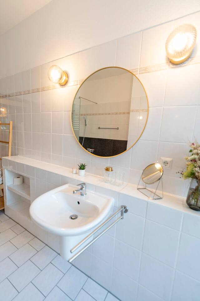 Bathroom with large mirror