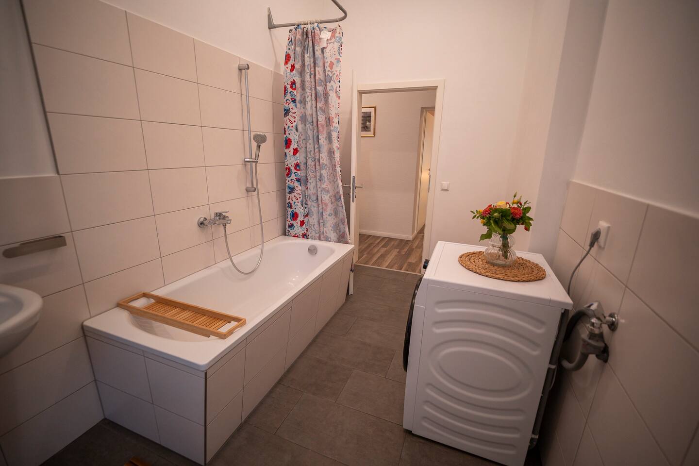 Bathroom with washing machine and bench