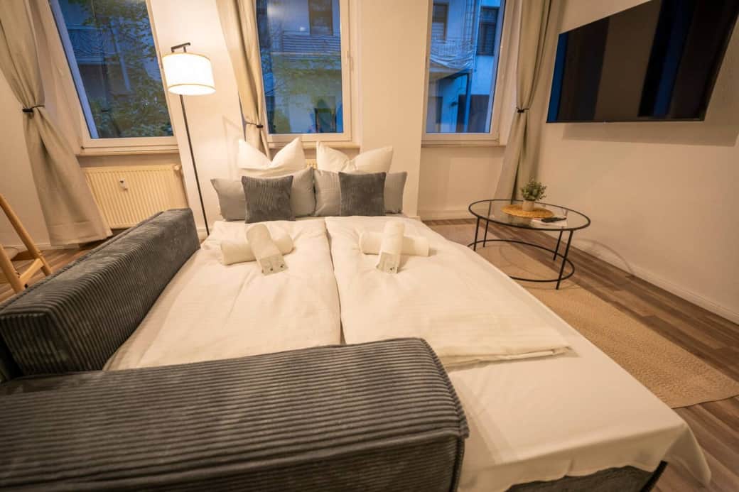 Living room with sofa bed & TV