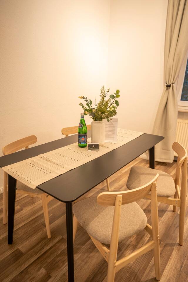 Large dining table in the living room - ideal for shared meals