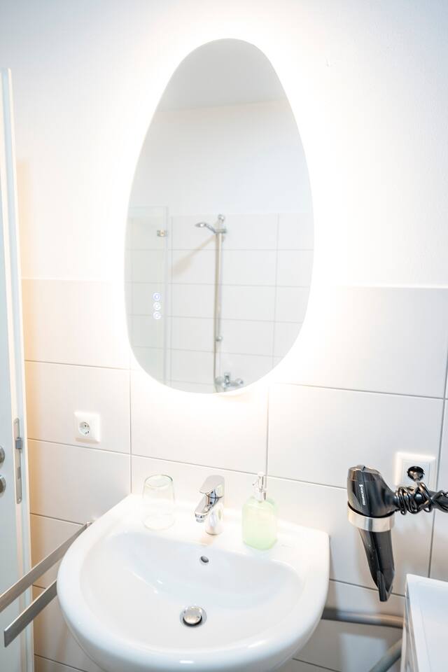 Bright bathroom with large mirror