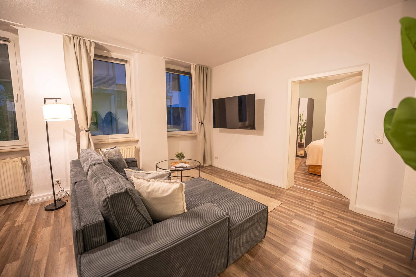 Living room with cozy sofa & Smart TV