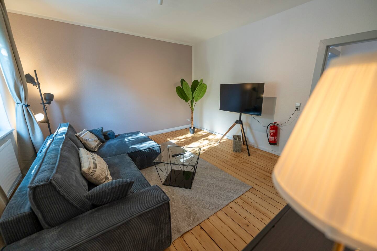 Living room with a comfortable sofa bed & TV