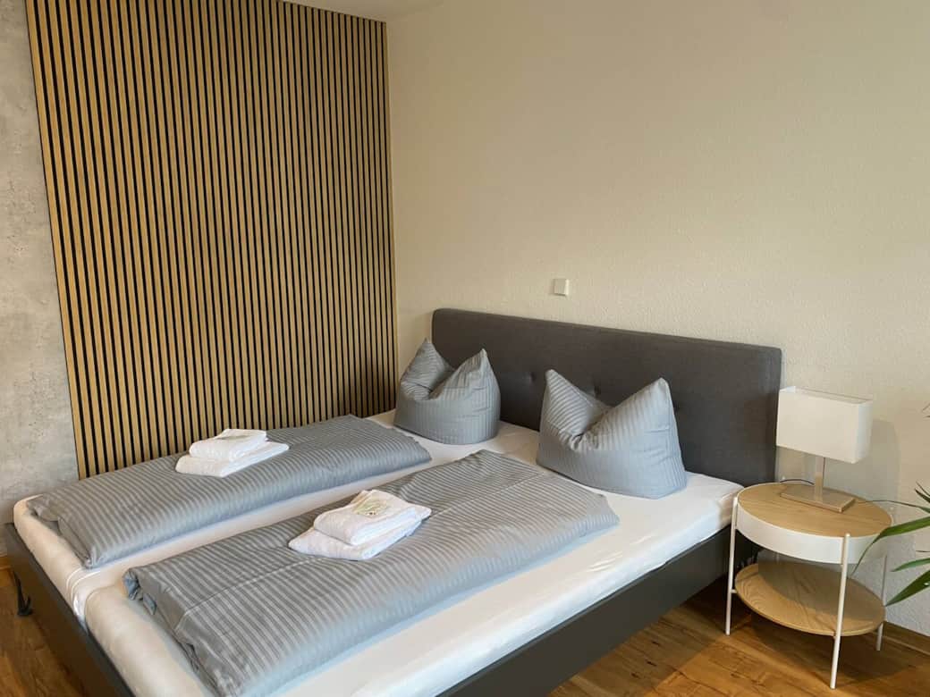 Double bed (180x200) with a bedside table