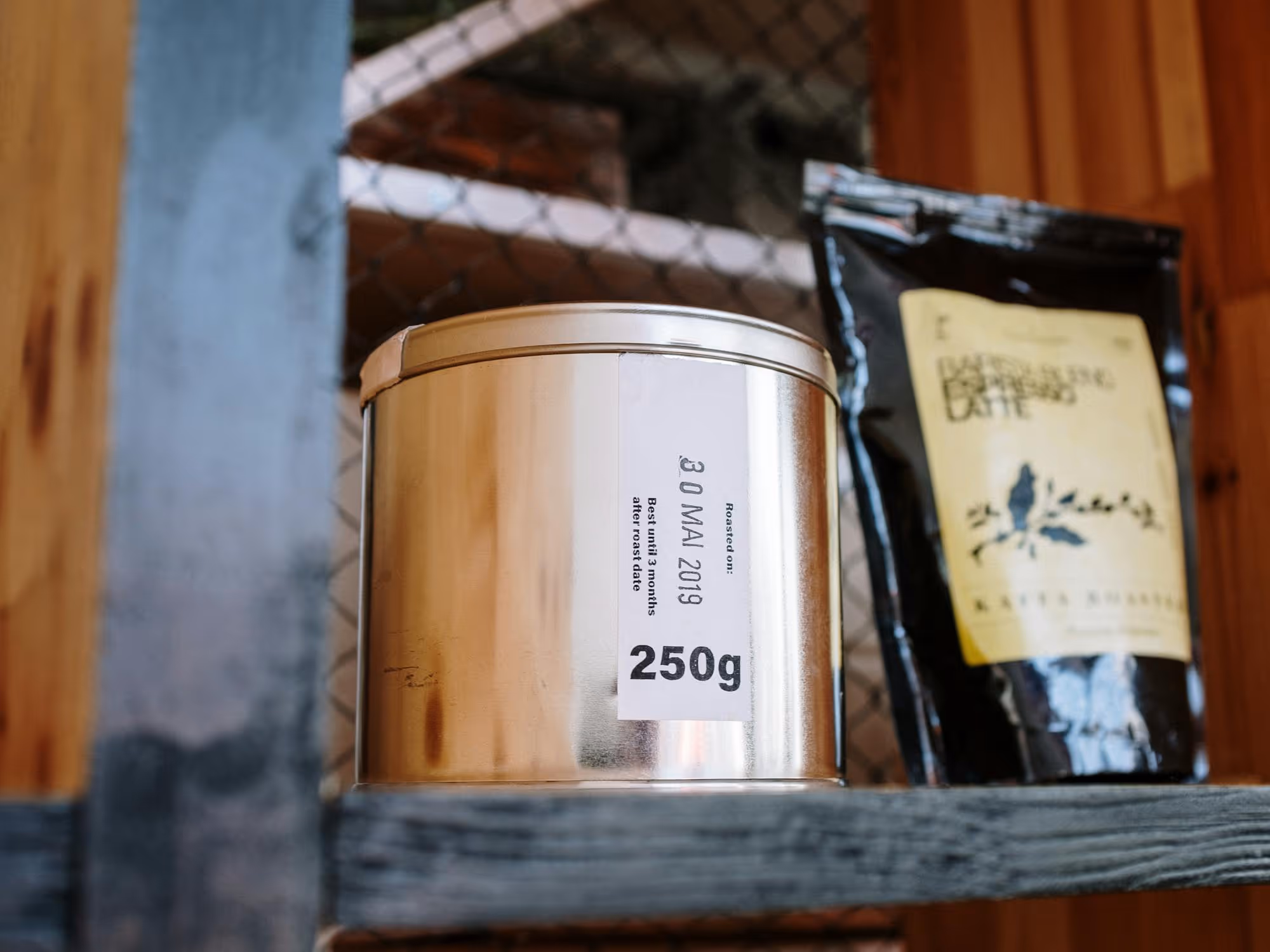 Coffee products arranged on a minimal wooden shelf