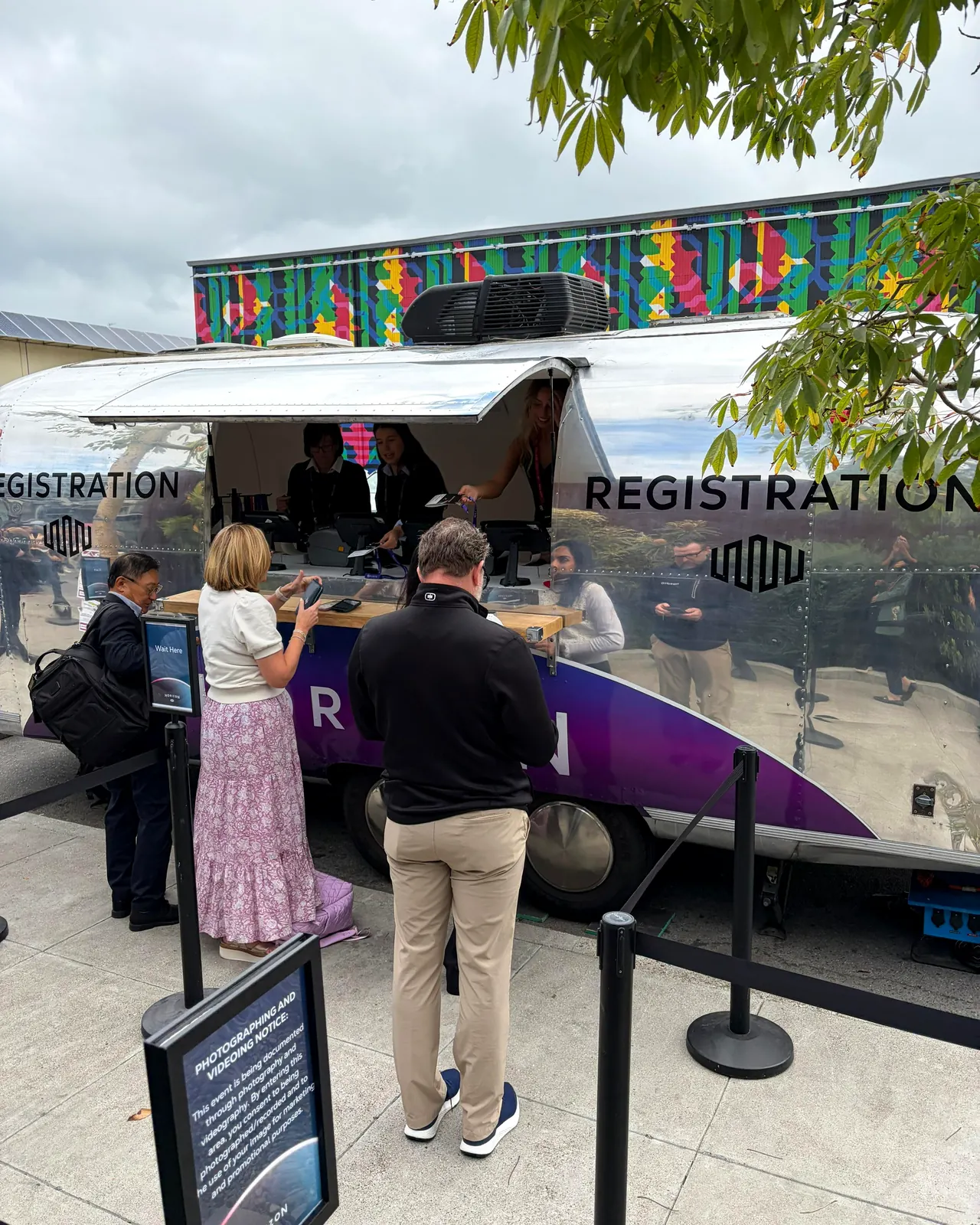 Conference guest registration desk built into a vintage Airstream