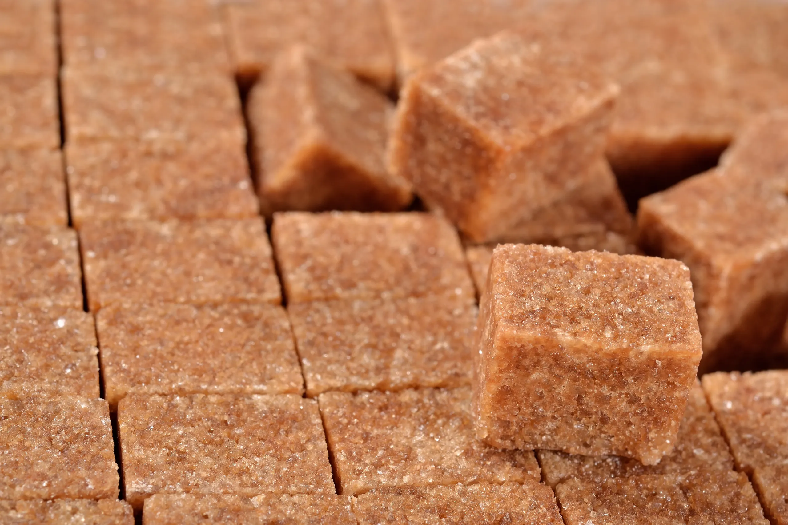 Close-up of raw cane sugar cubes