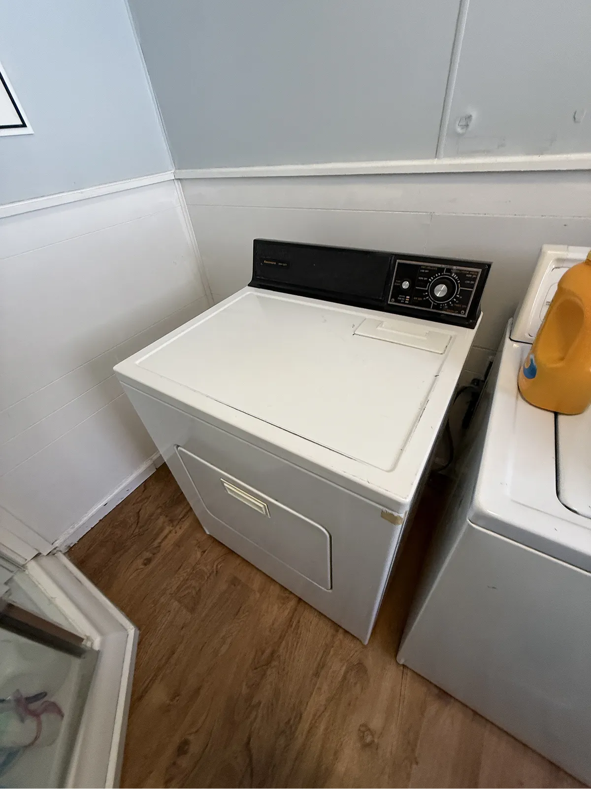Kenmore top-load dryer in a residential laundry room