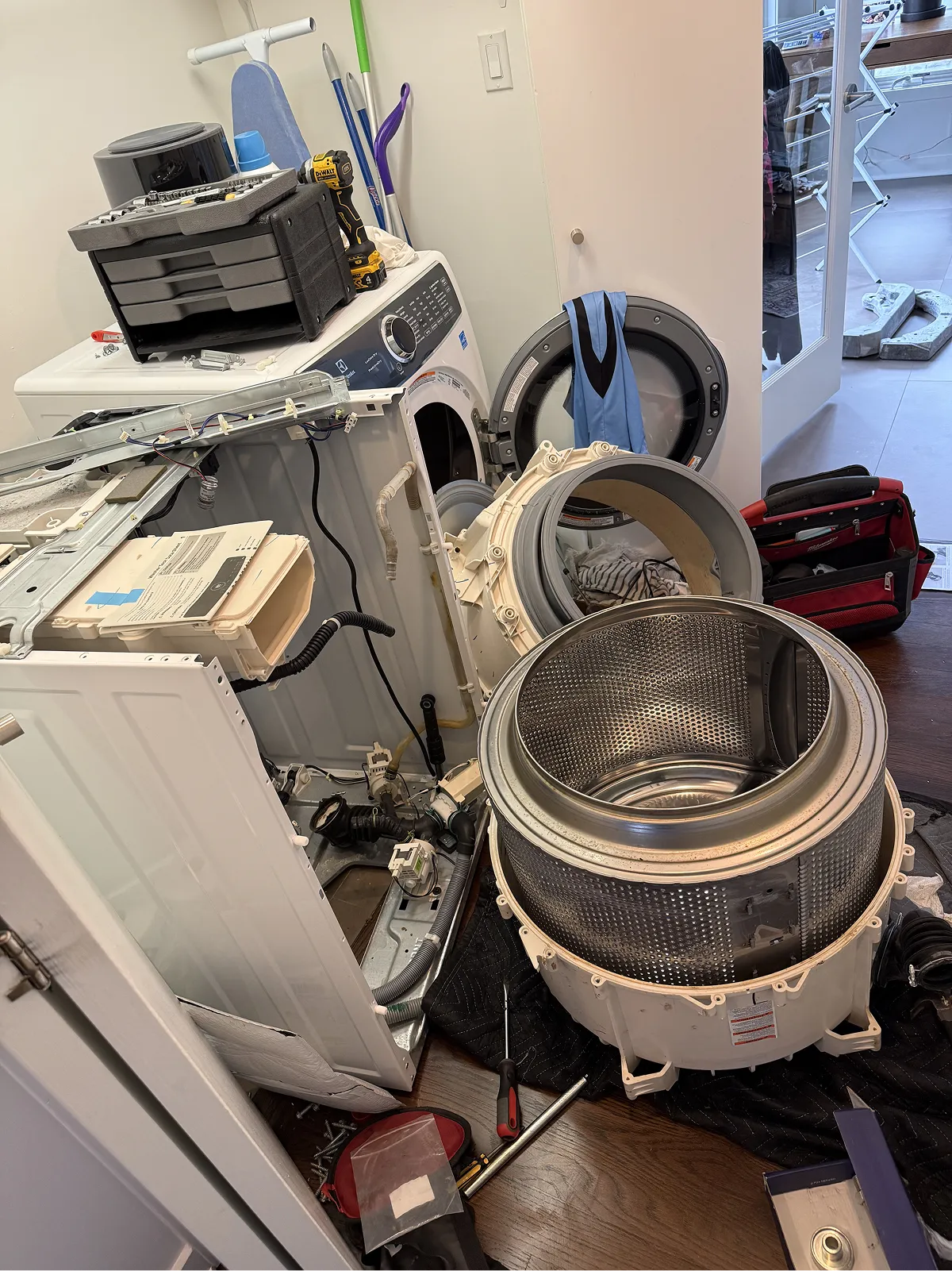 Front-load washer fully disassembled with drum and door seal removed during a washer repair service call in NJ