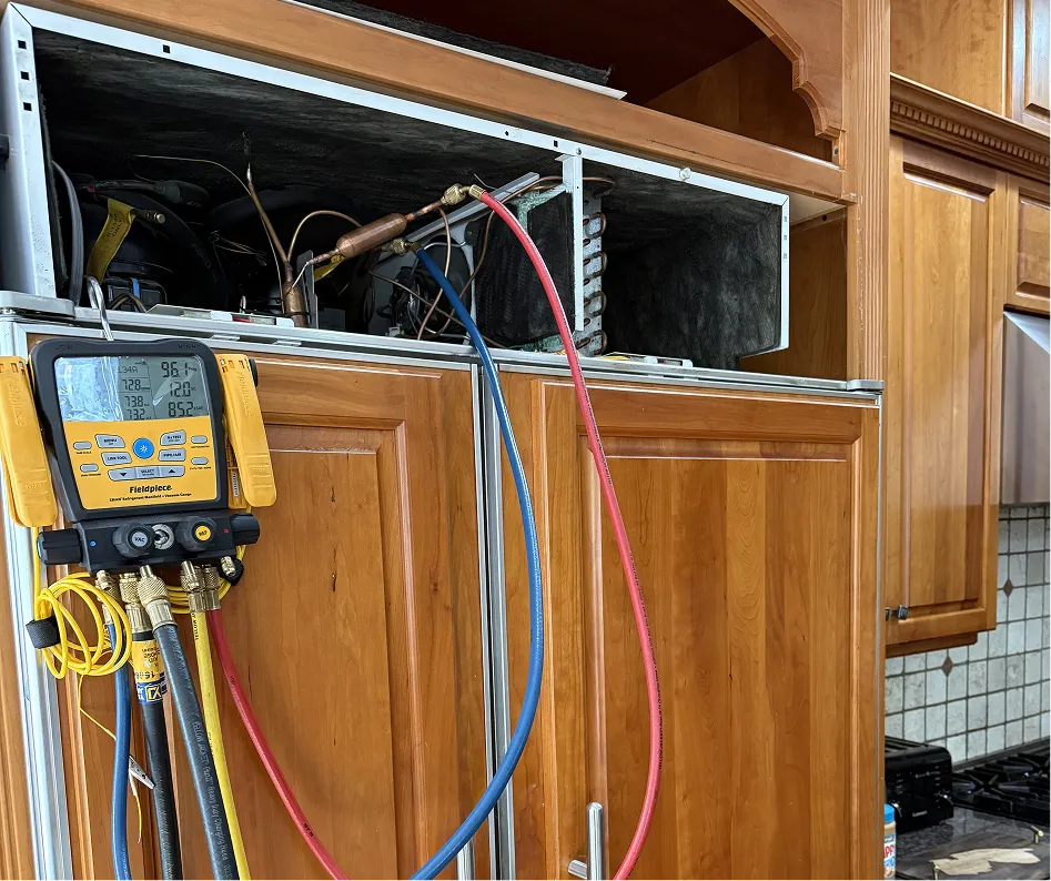 Fieldpiece refrigerant manifold gauge connected to a built-in refrigerator during a refrigerant diagnostic in Bridgewater NJ