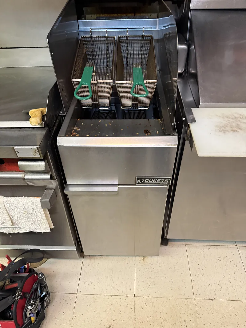 Dukers commercial gas fryer being serviced by ProFix technician 