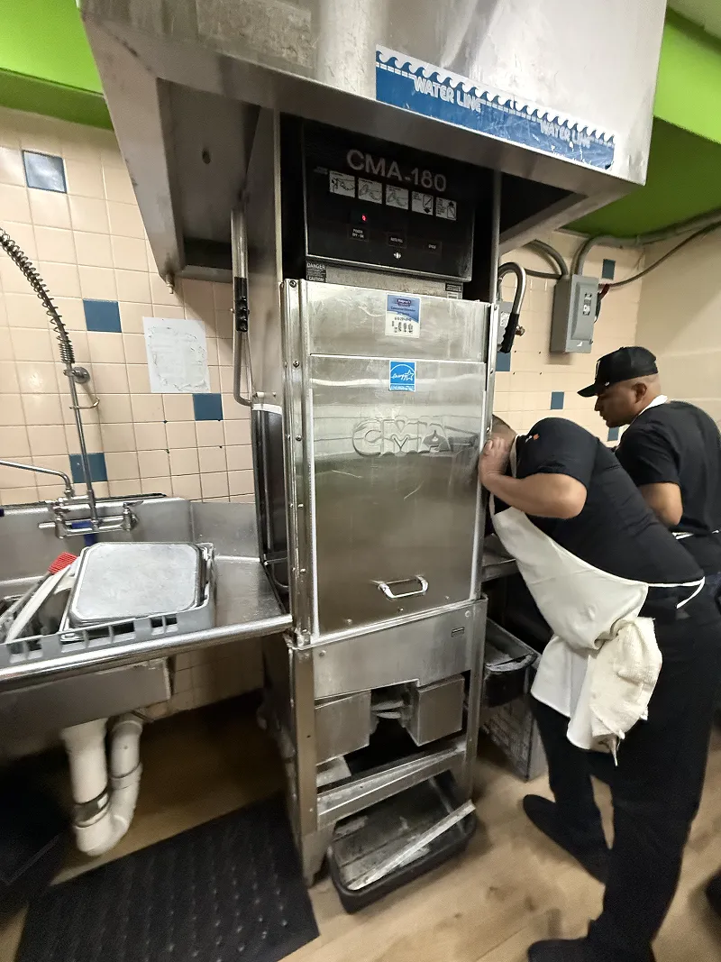 roFix technician repairing a CMA-180 door-type commercial dishwasher 