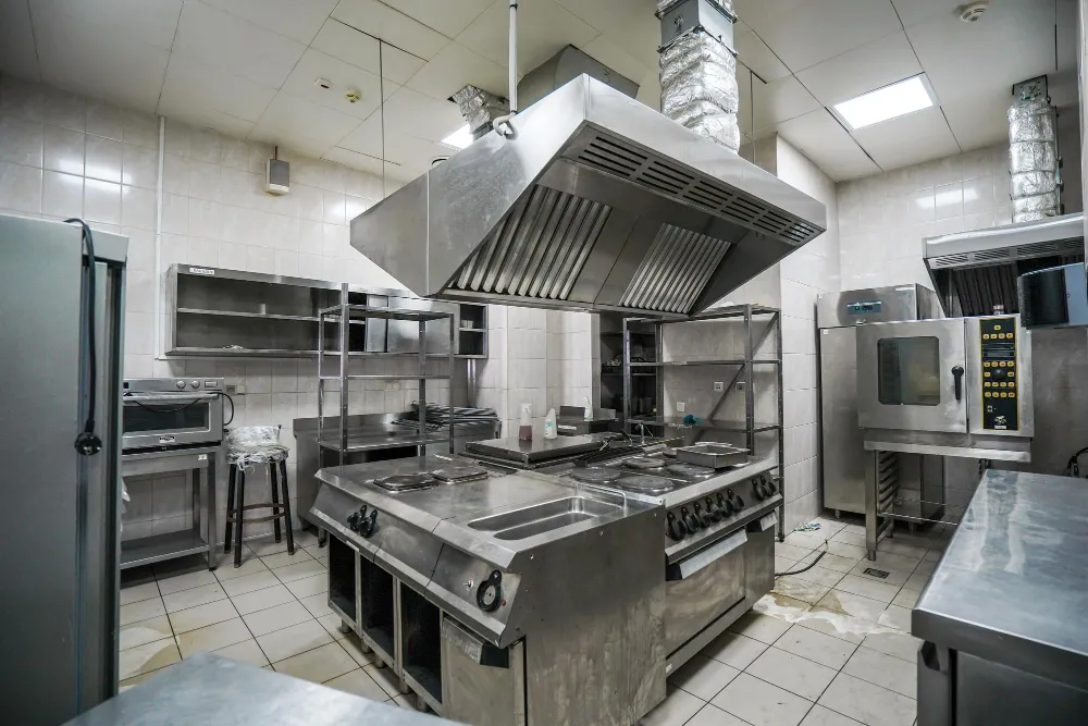 Full commercial kitchen with gas range
