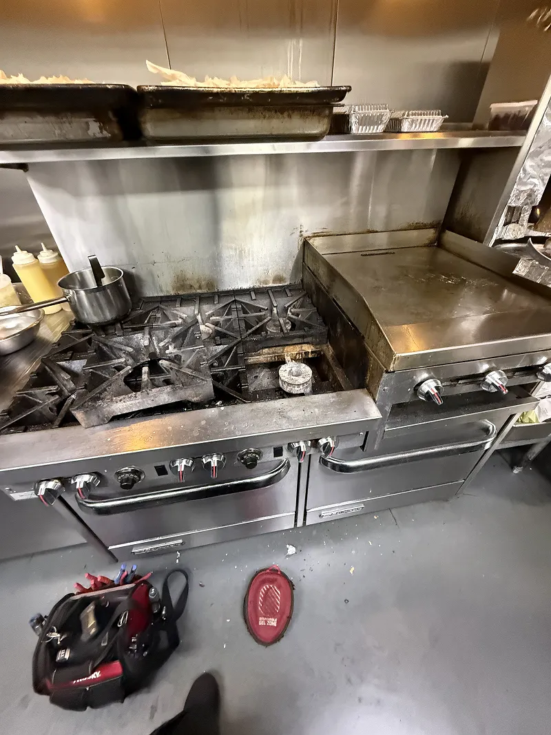 ProFix technician servicing a commercial gas range