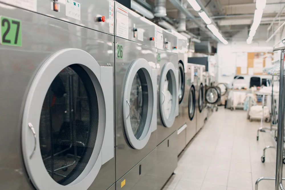 Industrial front-load washers in a commercial laundromat facility