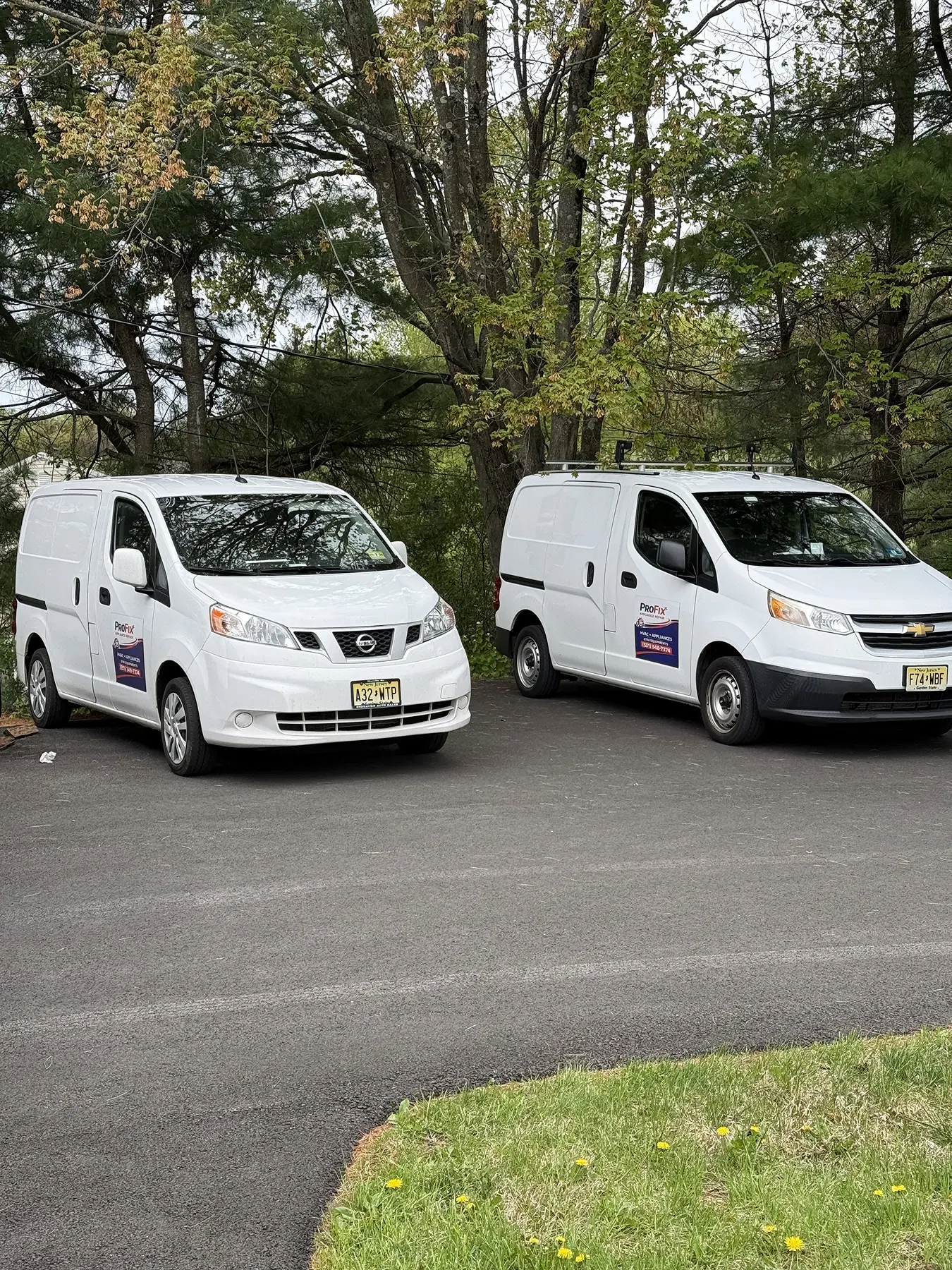 Pro fix vans parked on the street 