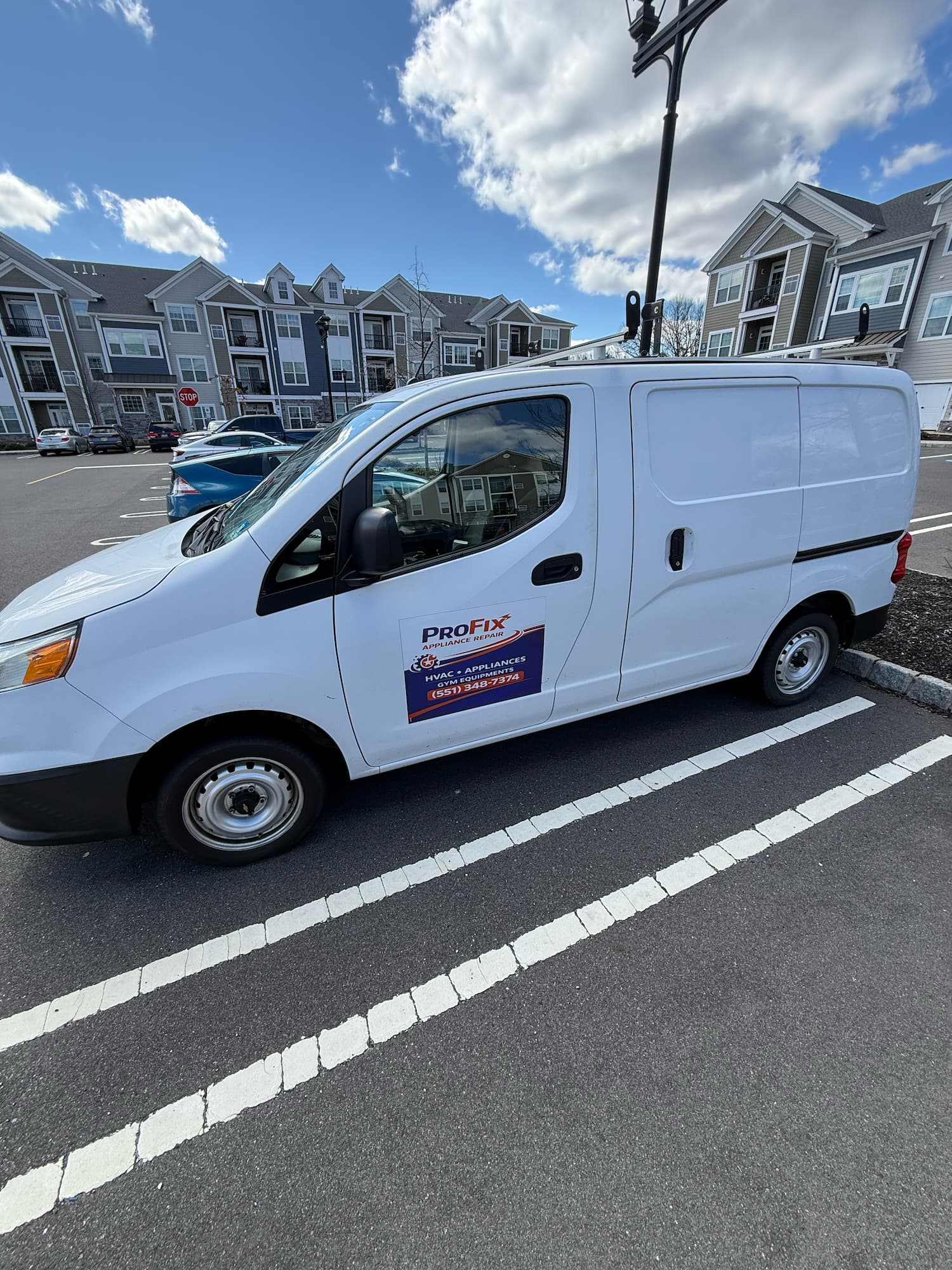 ProFix Appliance Repair van parked at a Somerville NJ apartment complex