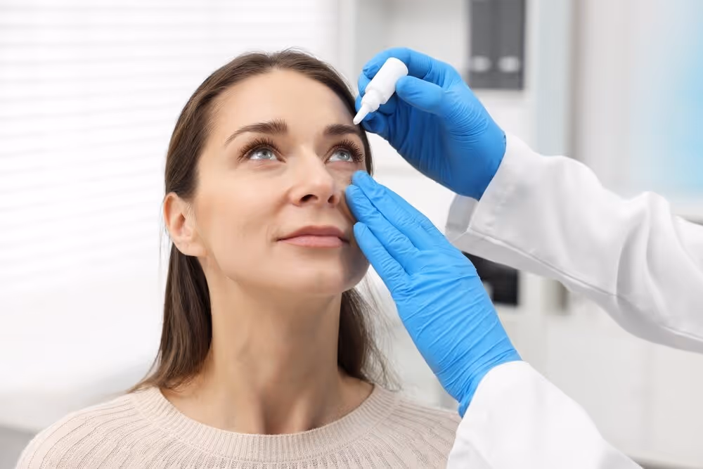 Optometrist Putting Eye Drops in a Woman