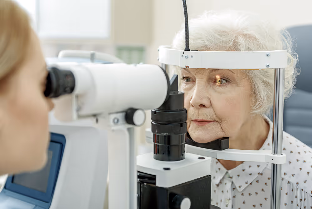 senior eye care. Lady getting eye exam.