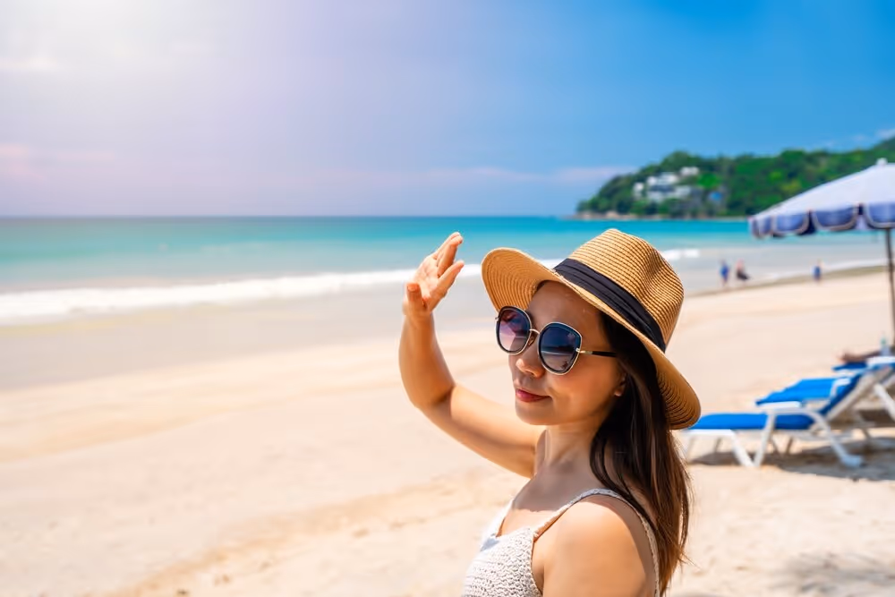 Woman wearing sunglasses. blocking UV Radiation from sun.
