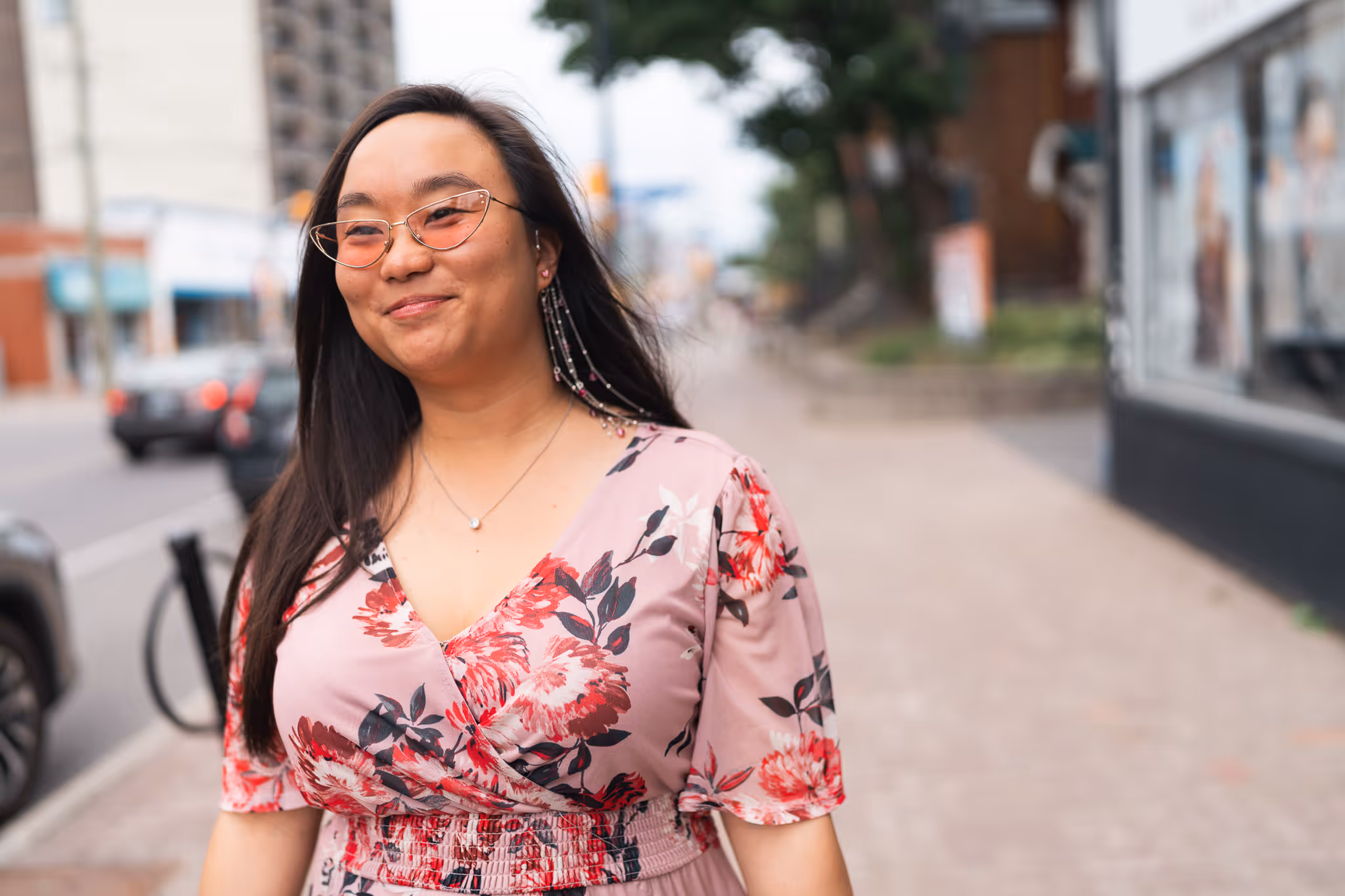 Woman walking happily with new glasses from Wellington Vision Care
