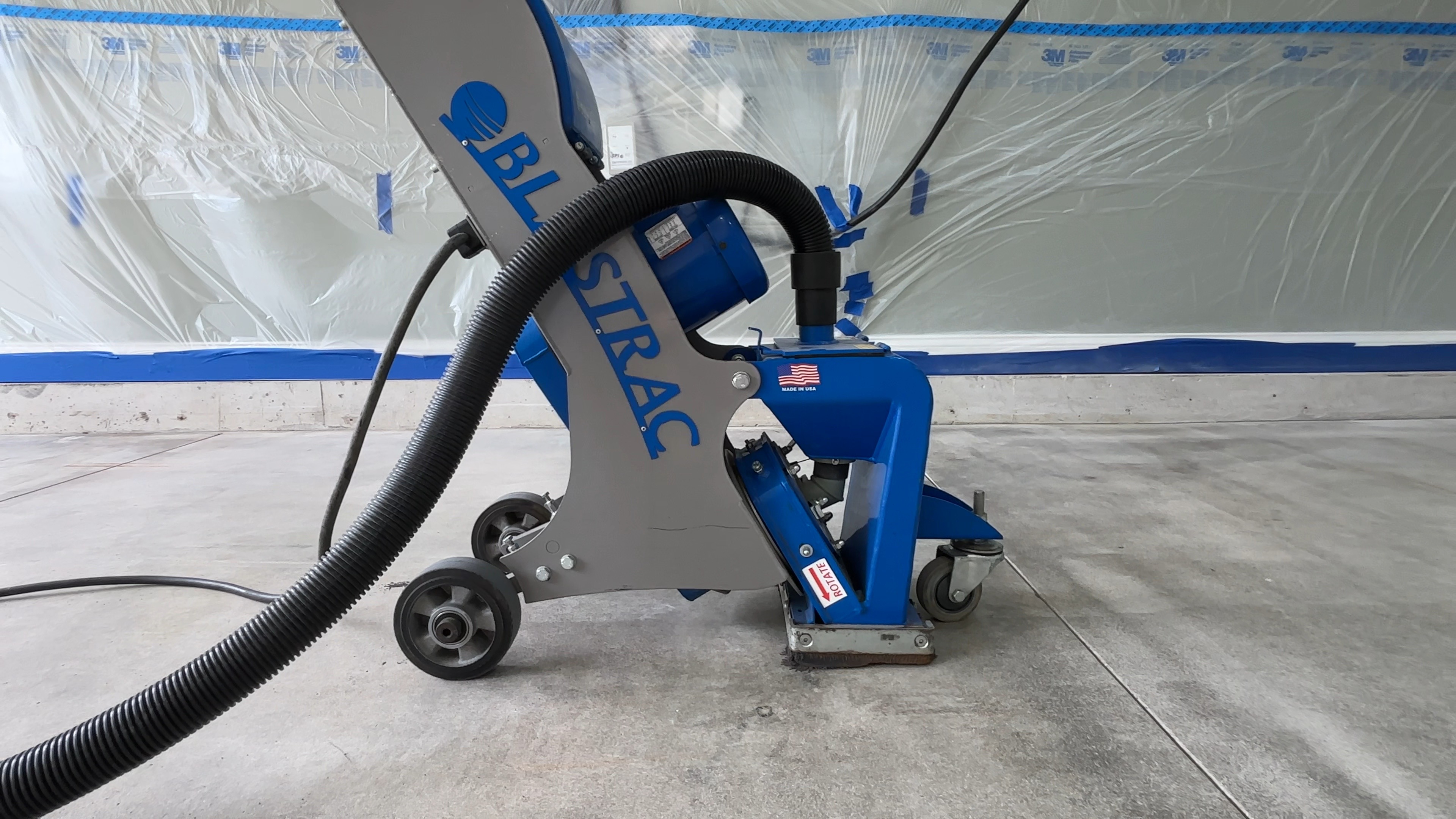 Flooring technician measuring moisture conditions across a concrete slab