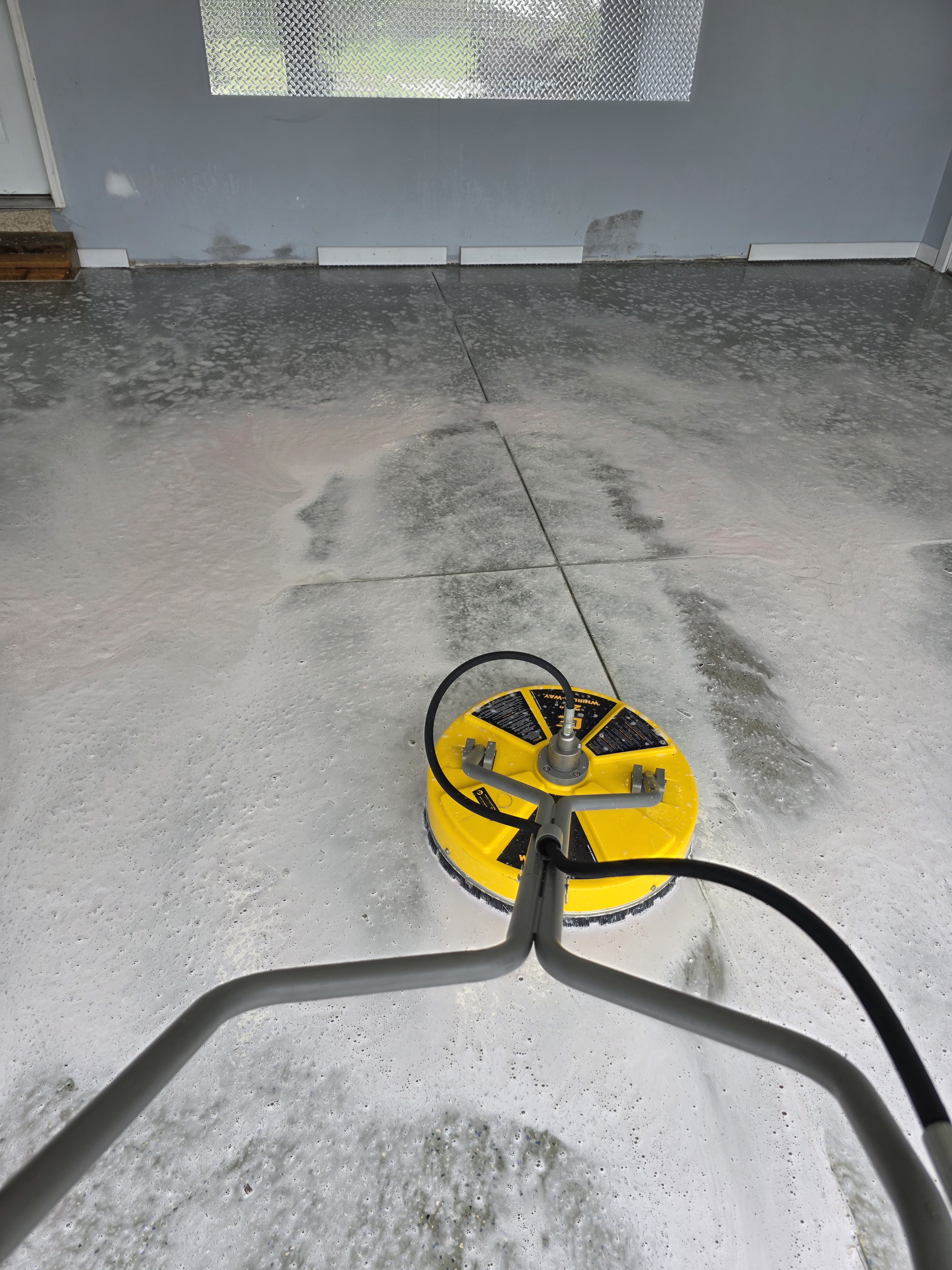 Technician installing an in-situ relative-humidity probe in a concrete slab
