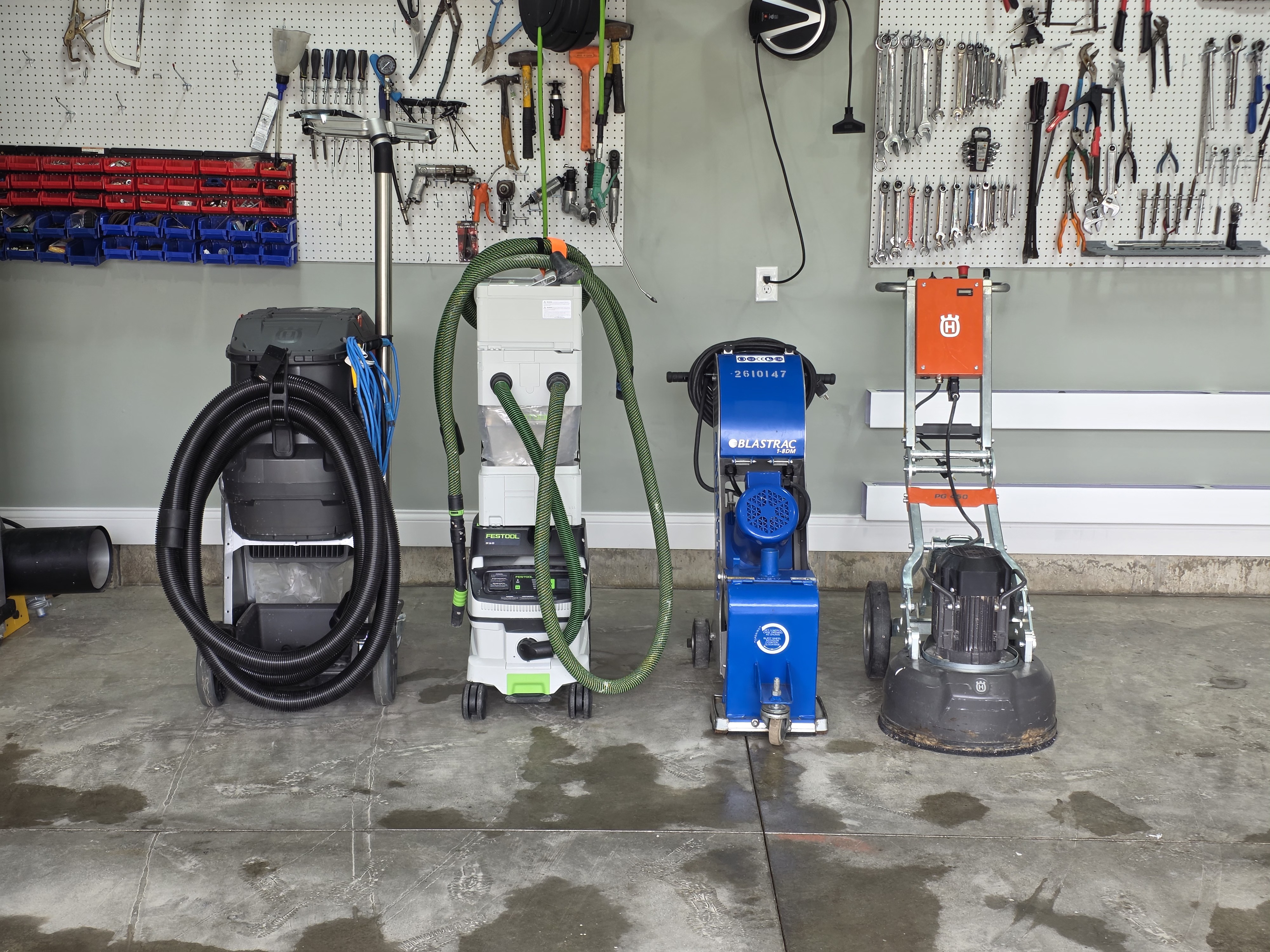 EverForge professional surface-preparation equipment including a Husqvarna 120V floor grinder