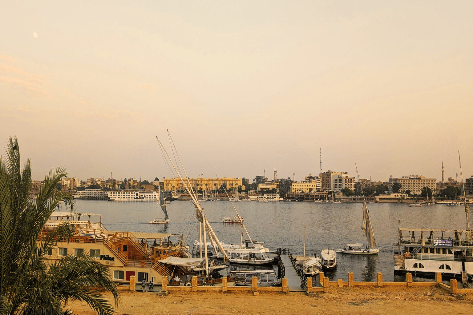 View across the Nile from Luxor's West Bank toward the East Bank — the two sides of the city create genuinely different travel experiences